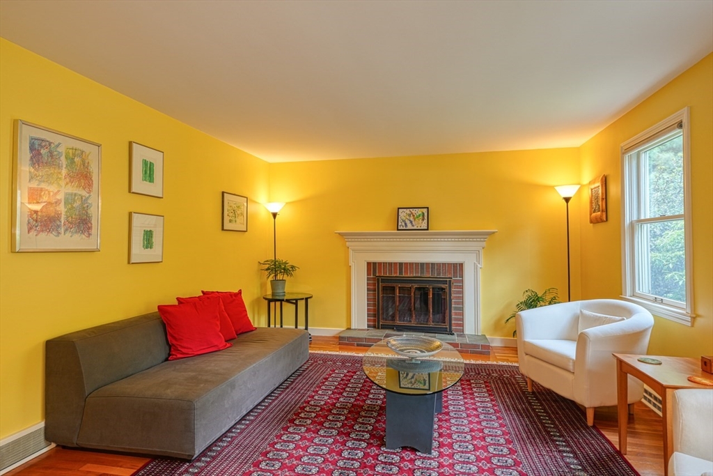 27 Wheeler Road Westborough, MA 01581 - Photo 7 of 41 a living room with furniture and a fireplace