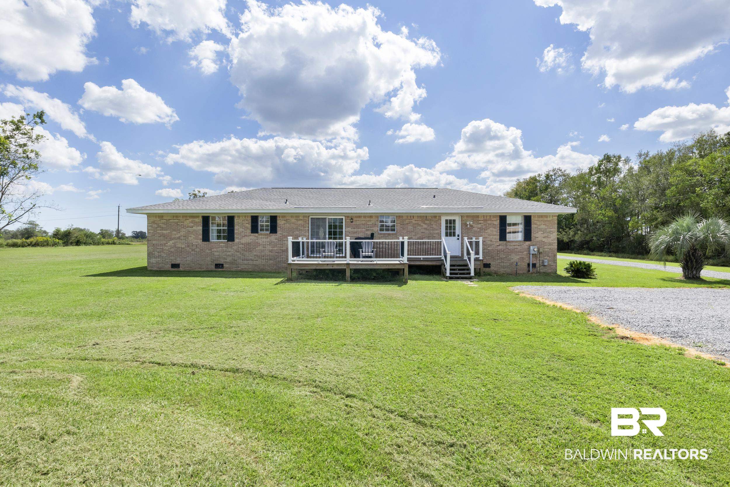 17689 Brewer Road Foley, AL 36535 - Photo 45 of 54 Ranch-style house featuring a front yard and a wooden deck
