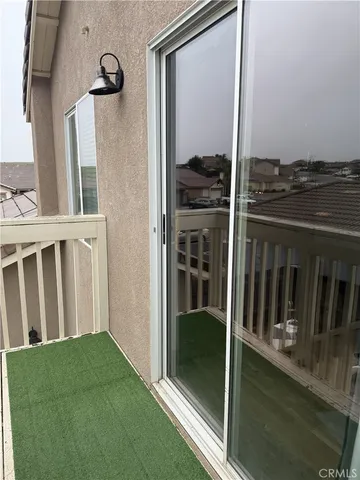 a view of balcony and front door