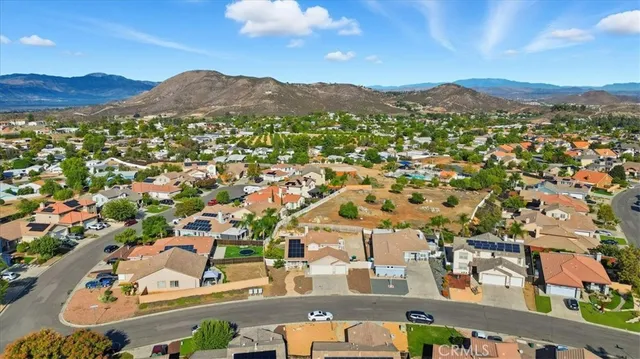 an aerial view of residential house and sandy dunes