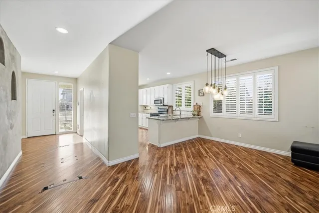a view of kitchen and wooden floor