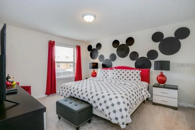 a bedroom with a bed and a dresser