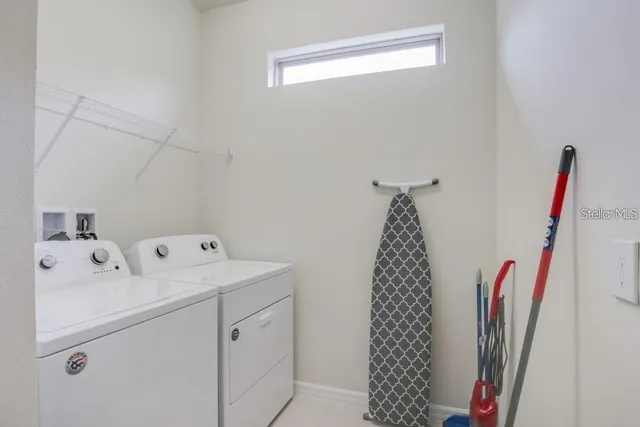 a utility room with dryer and washer