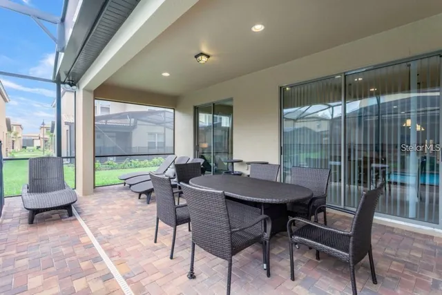 a view of a dining room with furniture window and outside view