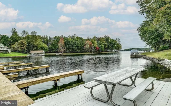 a view of a lake with outdoor seating