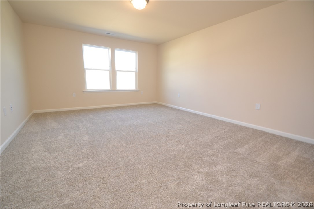 5703 Preveza Place Raleigh, NC 27603 - Photo 24 of 33 an empty room with a window