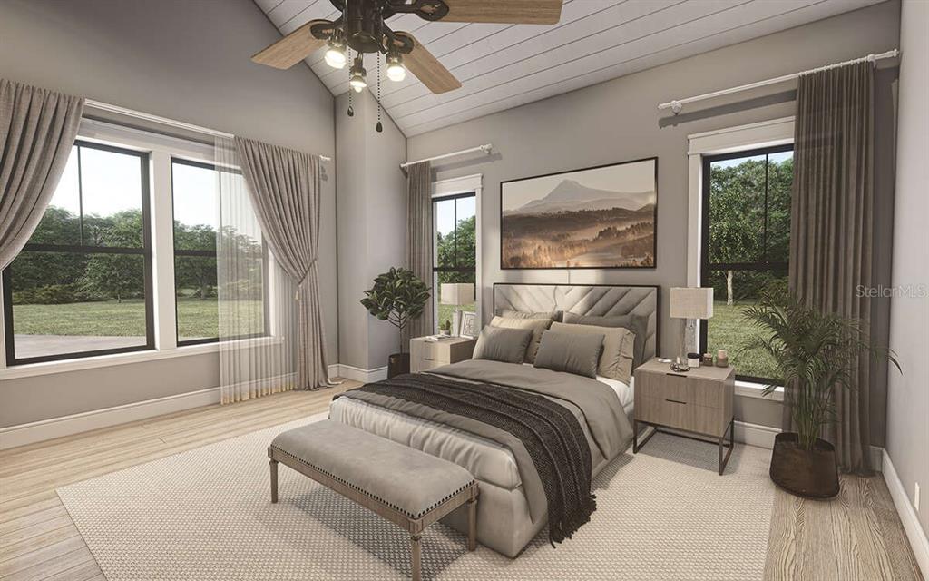 34710 Clayton Road Dade City, FL 33523 - Photo 10 of 17 a bedroom with a large bed and a large window