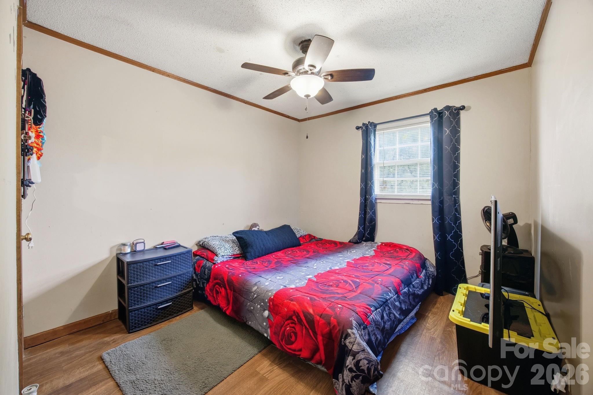 20 Ruby Street Rockwell, NC 28138 - Photo 15 of 38 a bedroom with a bed and a chandelier