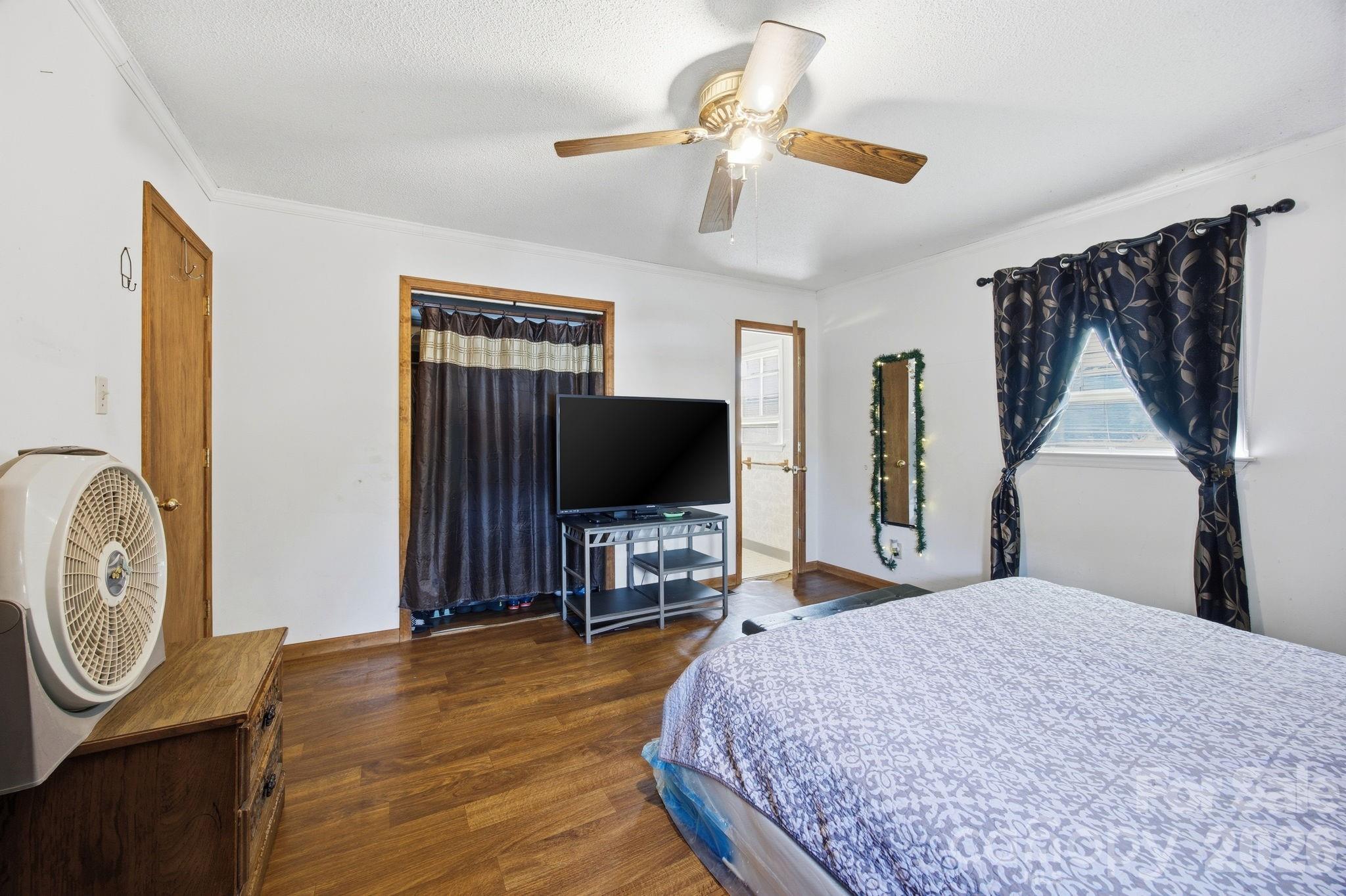 20 Ruby Street Rockwell, NC 28138 - Photo 18 of 38 a bedroom with a bed and a flat screen tv