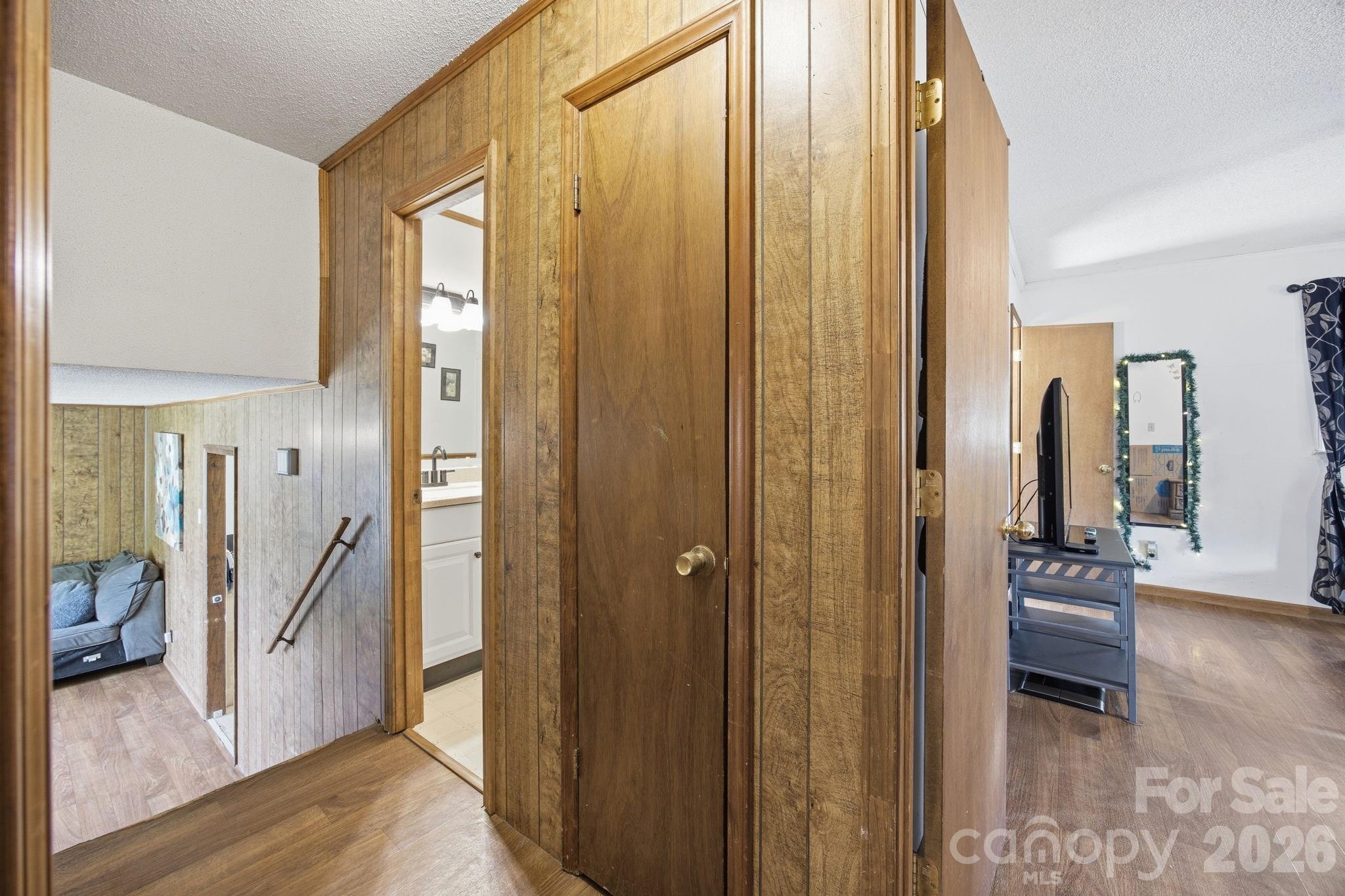 20 Ruby Street Rockwell, NC 28138 - Photo 19 of 38 a view of a hallway with wooden floor and furniture