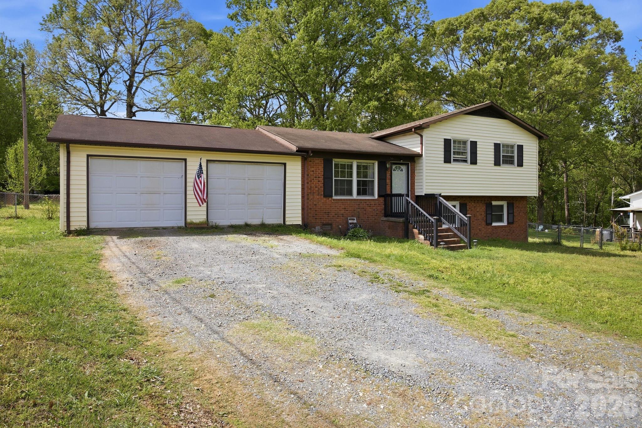 20 Ruby Street Rockwell, NC 28138 - Photo 25 of 38 a front view of house with yard and trees