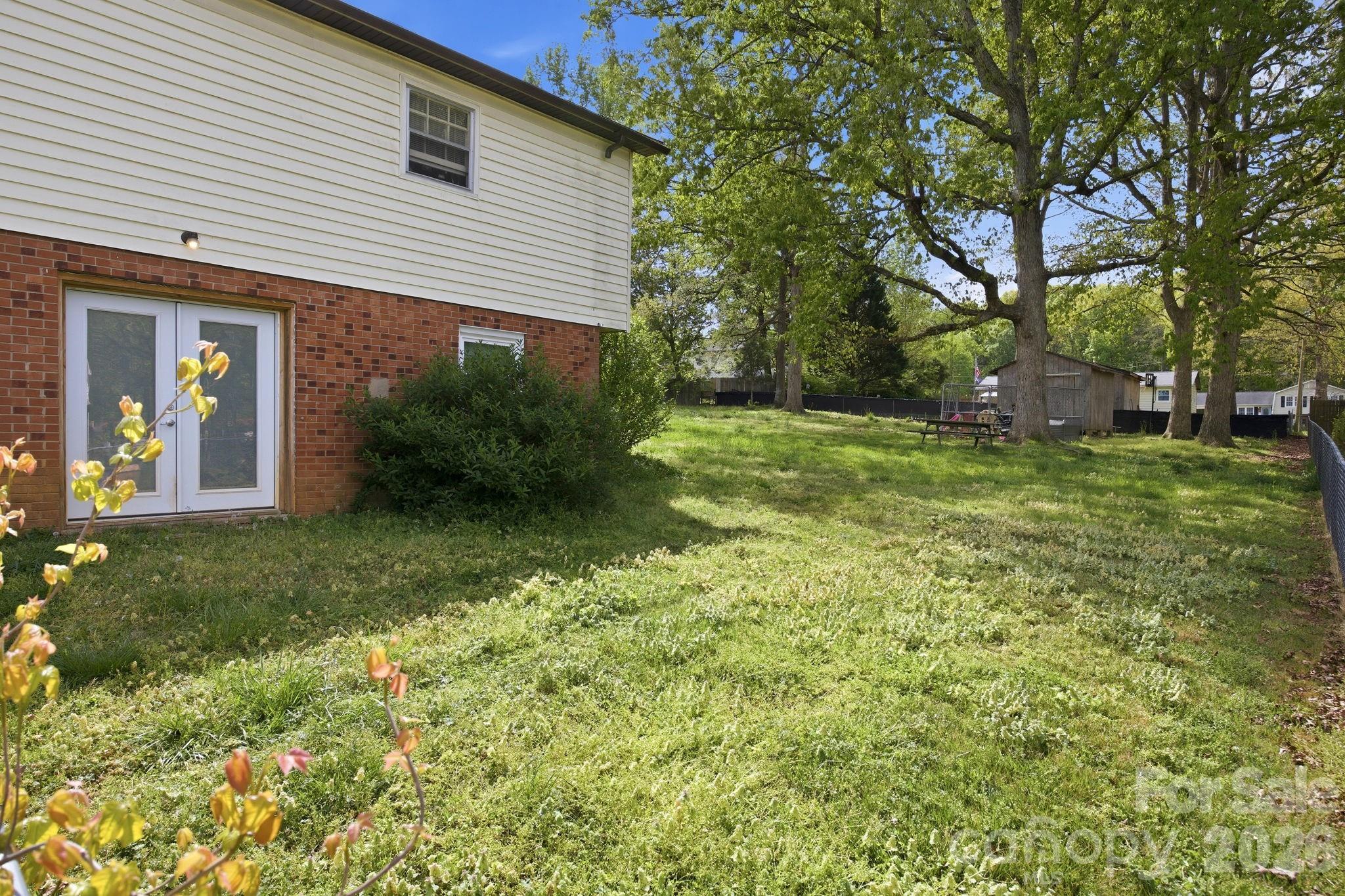 20 Ruby Street Rockwell, NC 28138 - Photo 36 of 38 a view of a backyard with plants and large trees