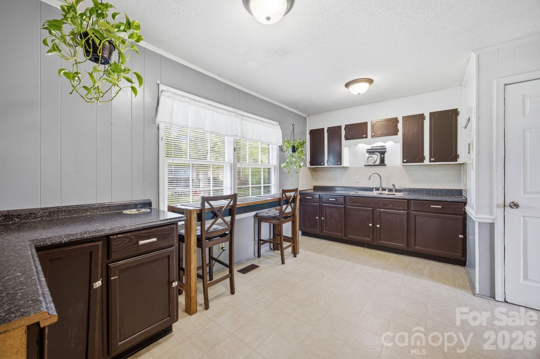 20 Ruby Street Rockwell, NC 28138 - Photo 7 of 38 a kitchen with a table and chairs