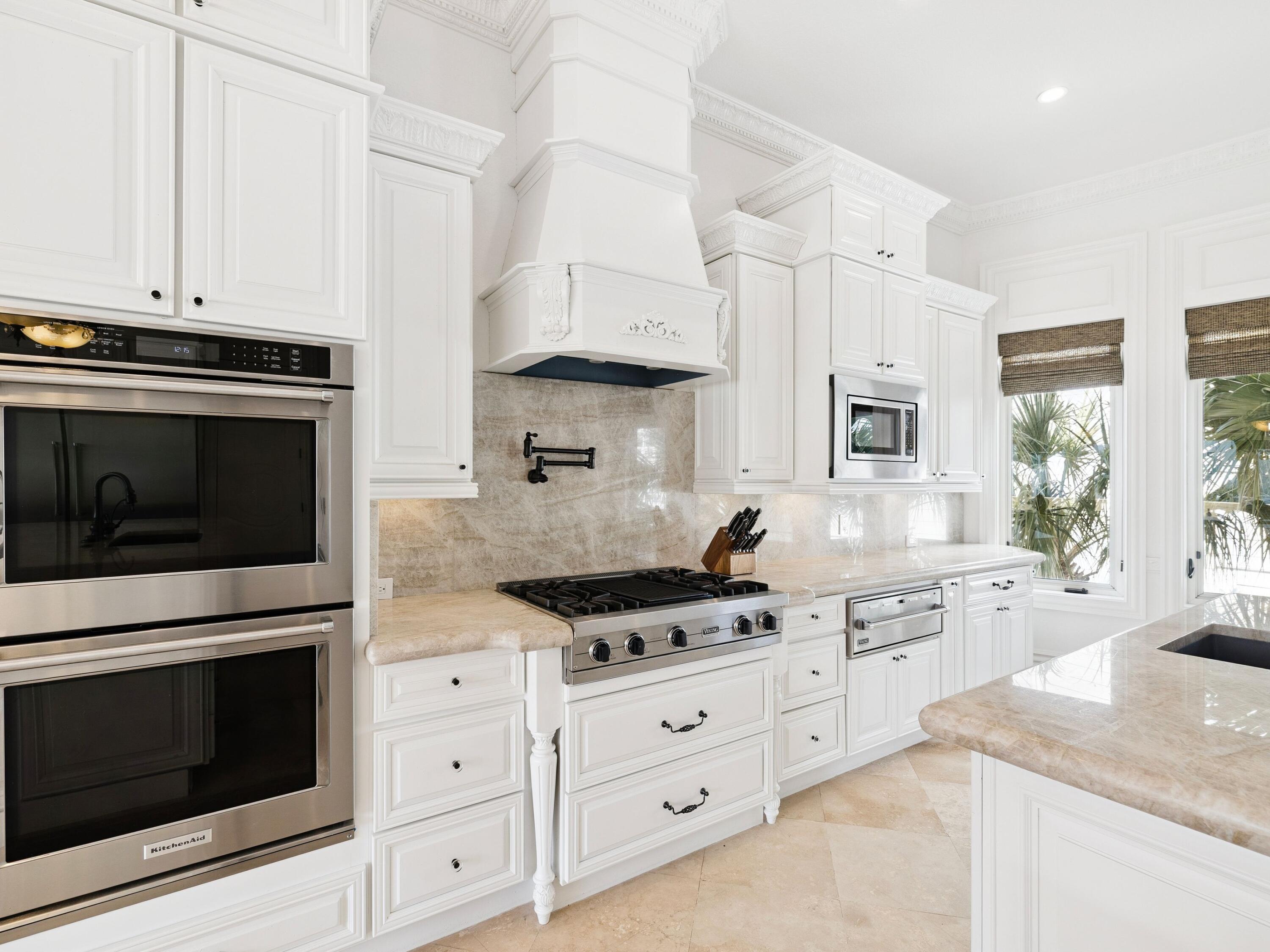 30 Pelican Circle Inlet Beach, FL 32461 - Photo 17 of 48 a kitchen with stainless steel appliances white cabinets and a stove a oven with wooden floor