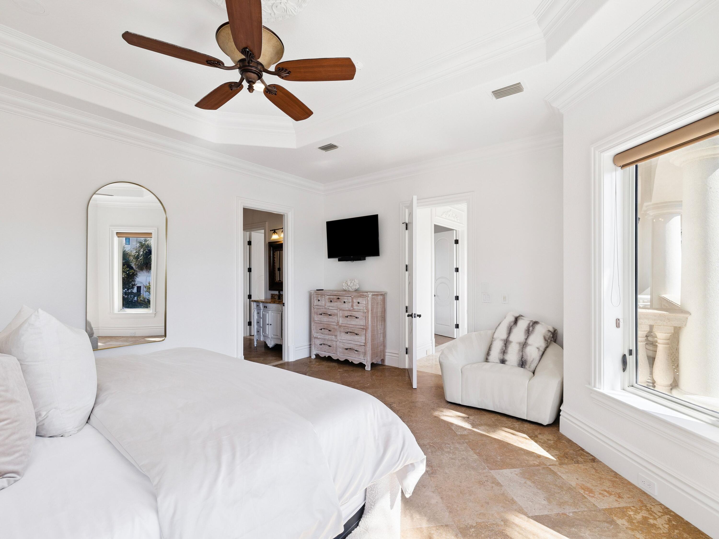 30 Pelican Circle Inlet Beach, FL 32461 - Photo 31 of 48 a bedroom with a bed couches and a flat tv screen