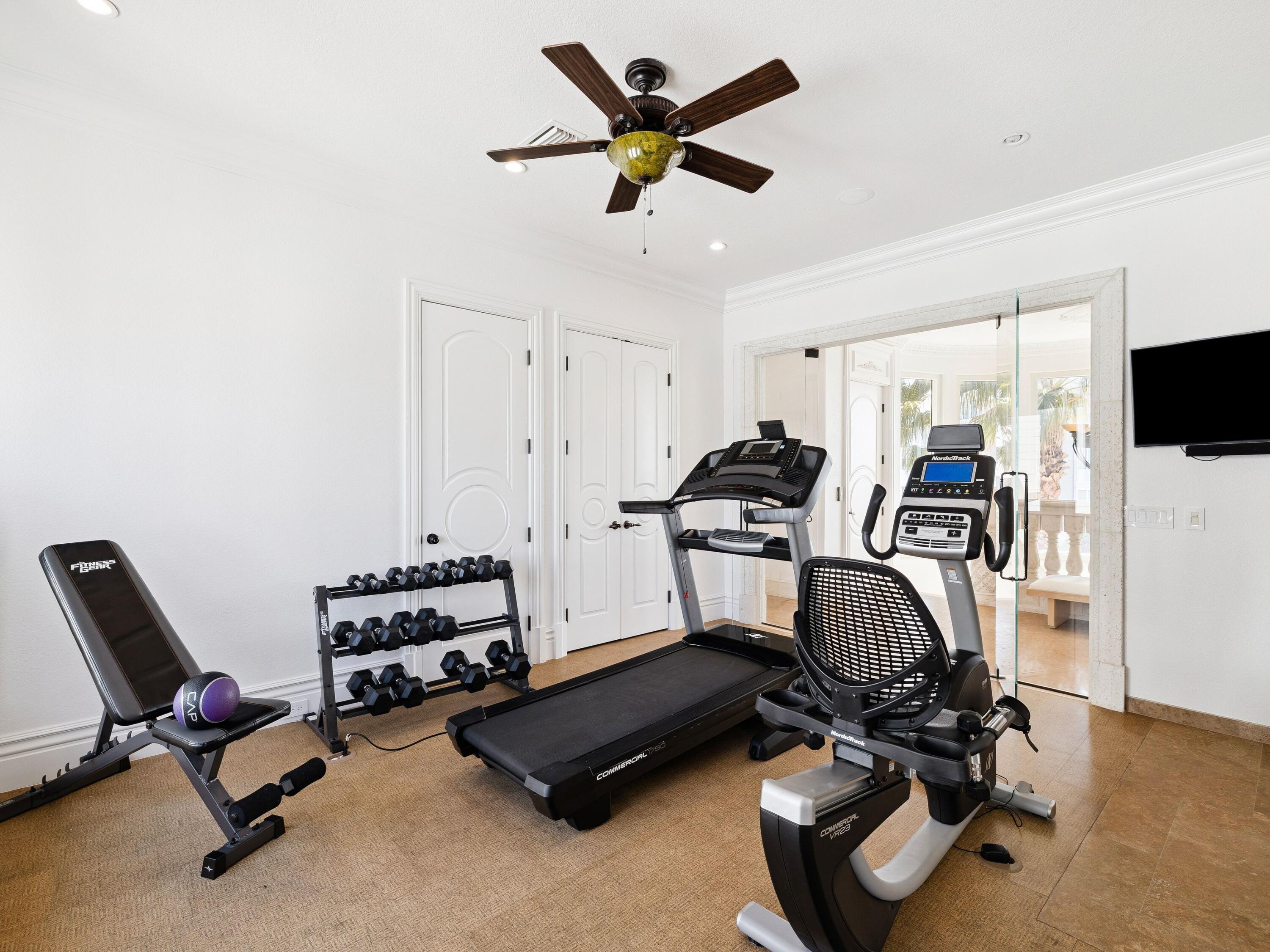 30 Pelican Circle Inlet Beach, FL 32461 - Photo 41 of 48 a room with gym equipment and a flat screen tv