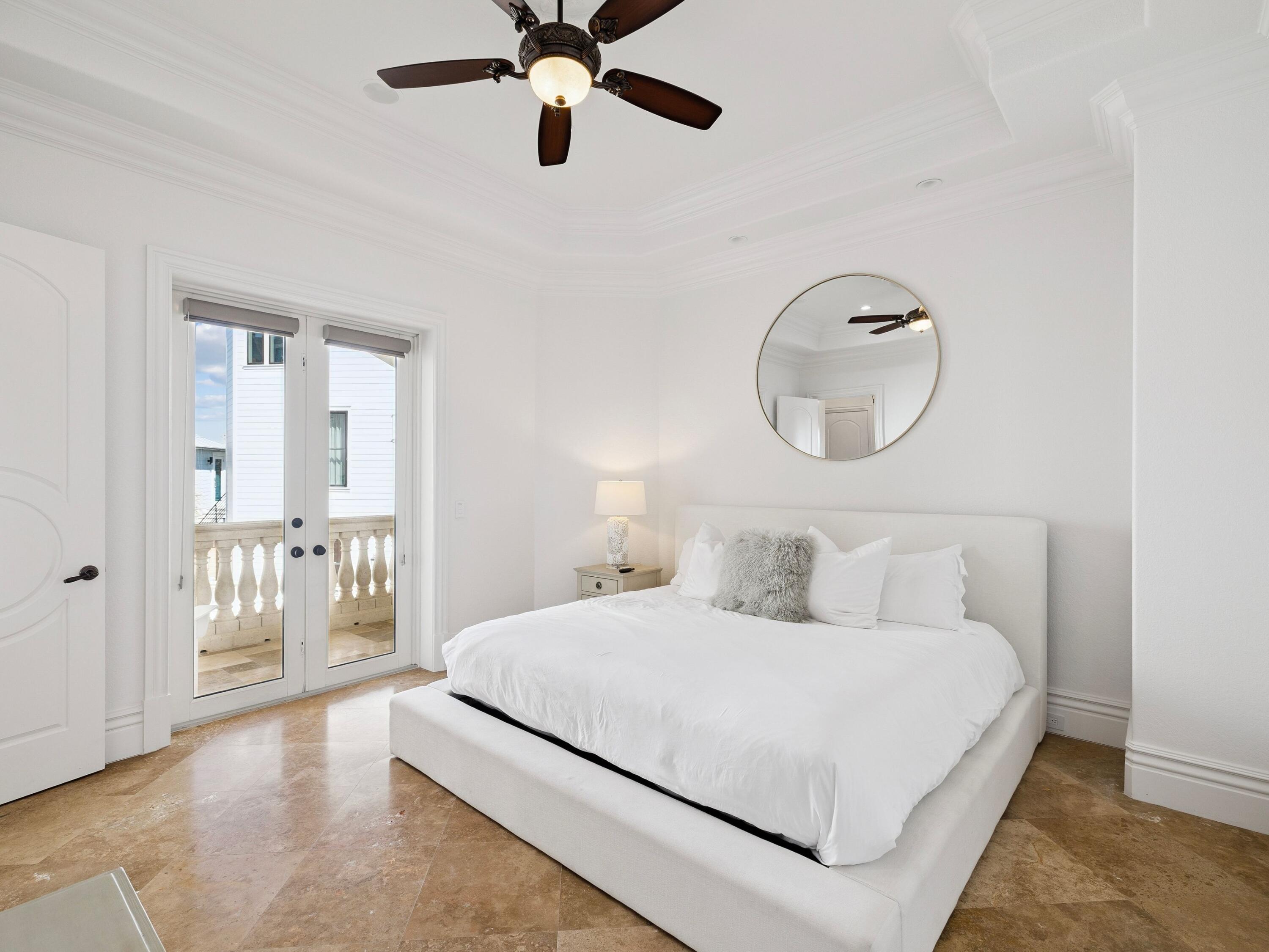 30 Pelican Circle Inlet Beach, FL 32461 - Photo 43 of 48 a bedroom with a large bed and chandelier