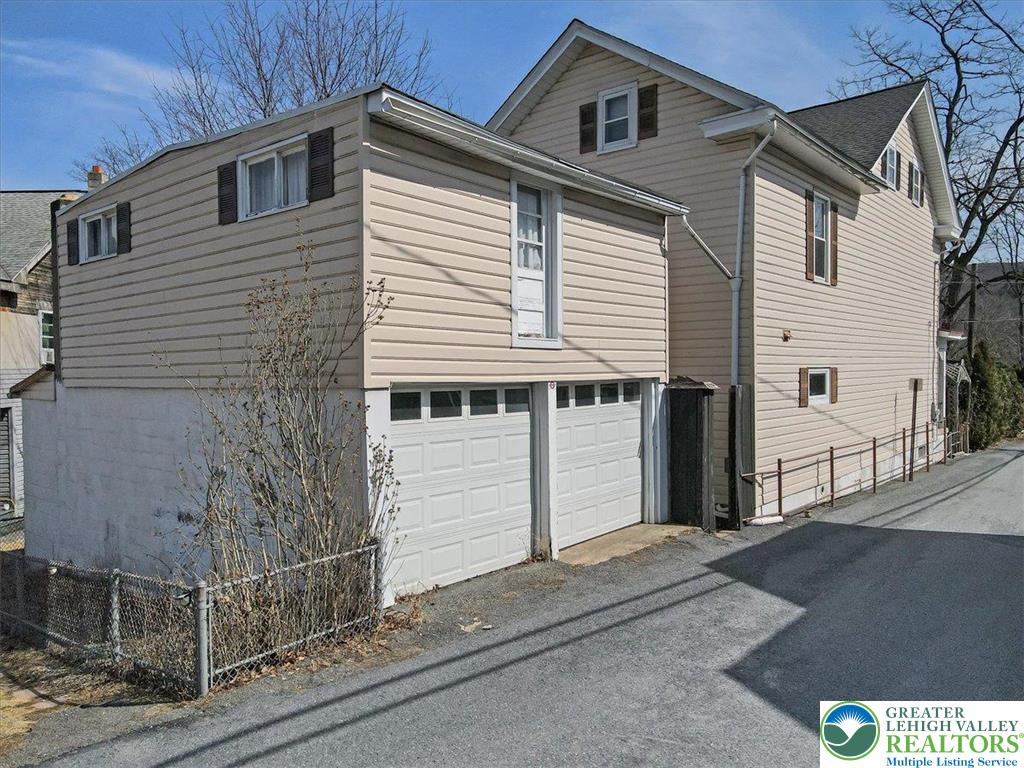 12 Chestnut Avenue Jim Thorpe, PA 18229 - Photo 28 of 38 a front view of a house with garage