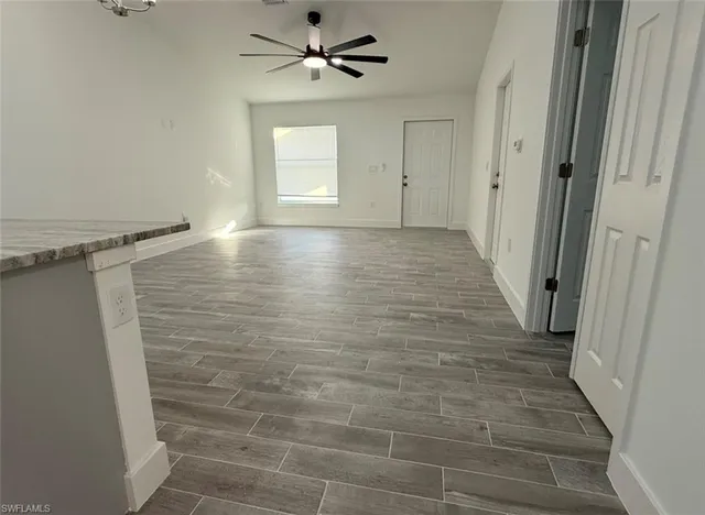 a view of room with window and hardwood floor