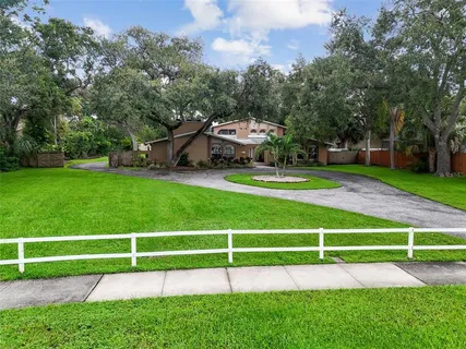 a view of a house with a sink and a yard