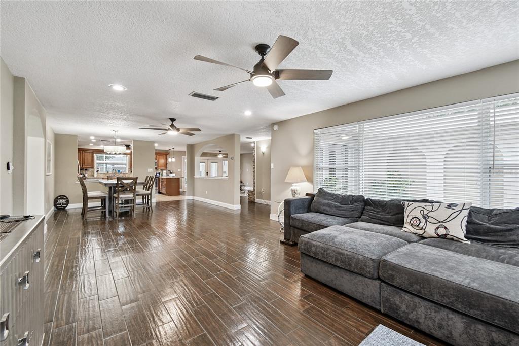 1948 Belleair Road Clearwater, FL 33764 - Photo 13 of 84 a living room with furniture and wooden floor