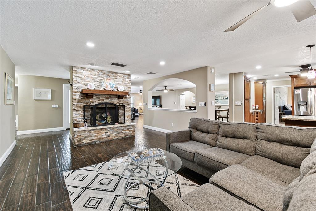 1948 Belleair Road Clearwater, FL 33764 - Photo 14 of 84 a living room with furniture and a fireplace