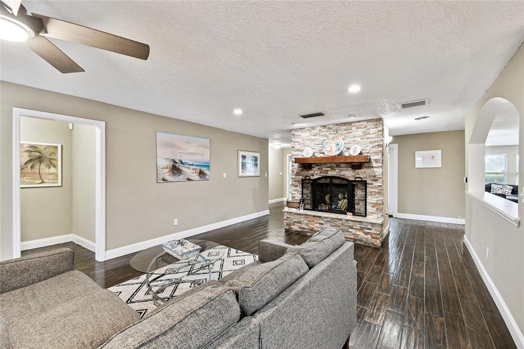 1948 Belleair Road Clearwater, FL 33764 - Photo 15 of 84 a living room with furniture and a fireplace