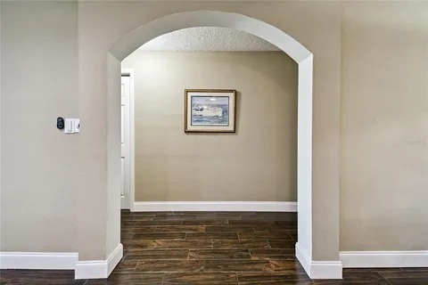 a bathroom with a granite countertop double vanity sink and a mirror
