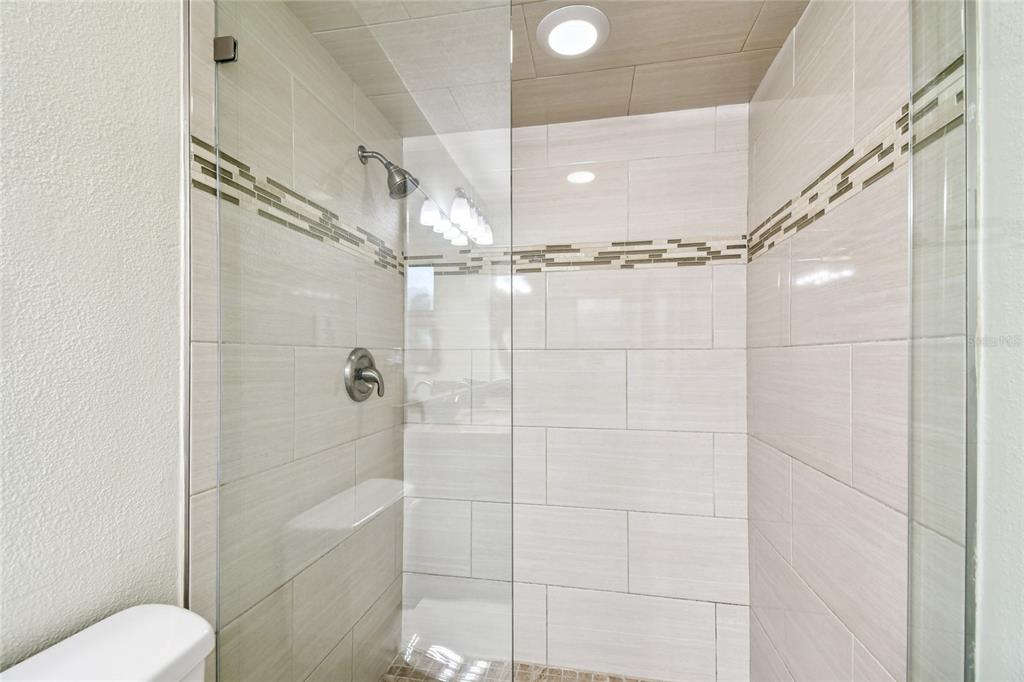 1948 Belleair Road Clearwater, FL 33764 - Photo 27 of 84 a bathroom with a shower