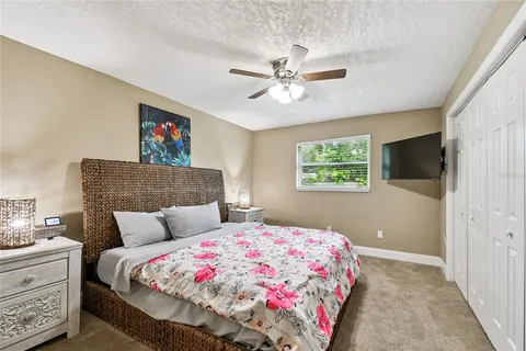 a living room with lots of furniture and a flat screen tv
