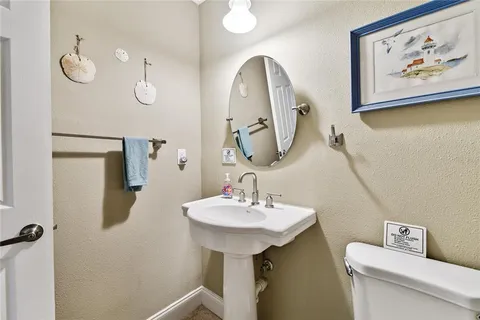 a bedroom with a bed lamp closet and window