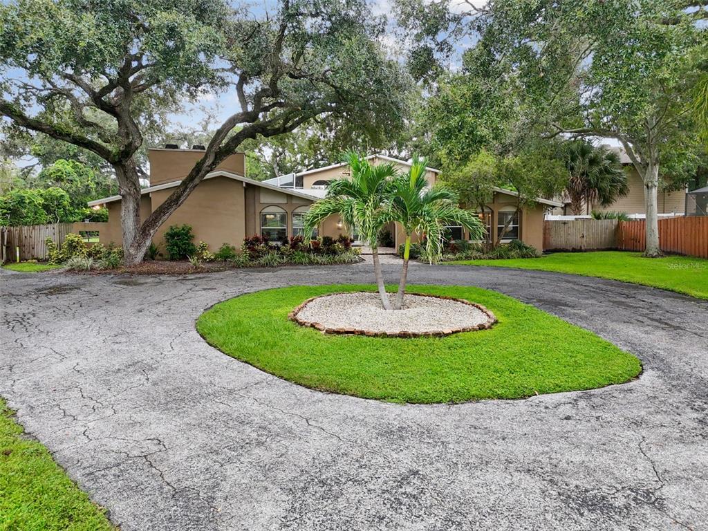 1948 Belleair Road Clearwater, FL 33764 - Photo 4 of 84 a view of a house with a sink and a yard