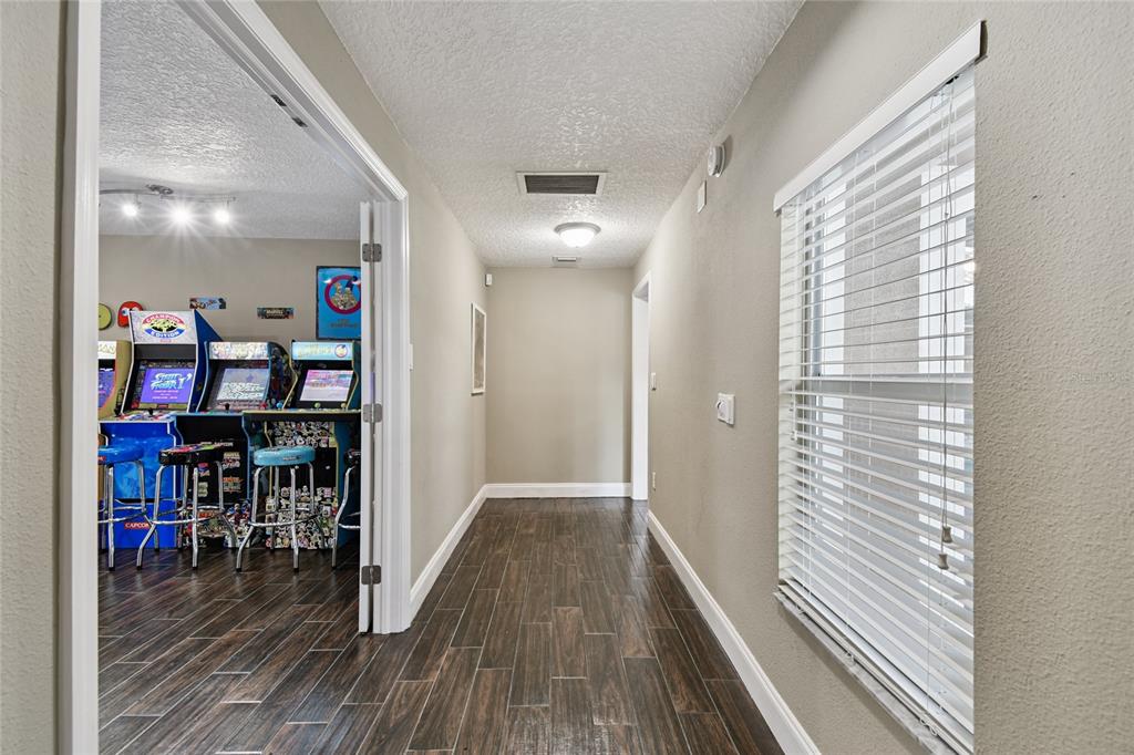 1948 Belleair Road Clearwater, FL 33764 - Photo 46 of 84 a view of a hallway with wooden floor and staircase