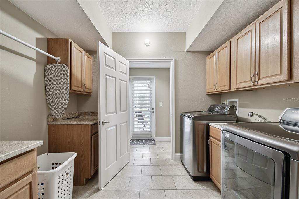 1948 Belleair Road Clearwater, FL 33764 - Photo 53 of 84 a kitchen with stainless steel appliances granite countertop a refrigerator and a stove