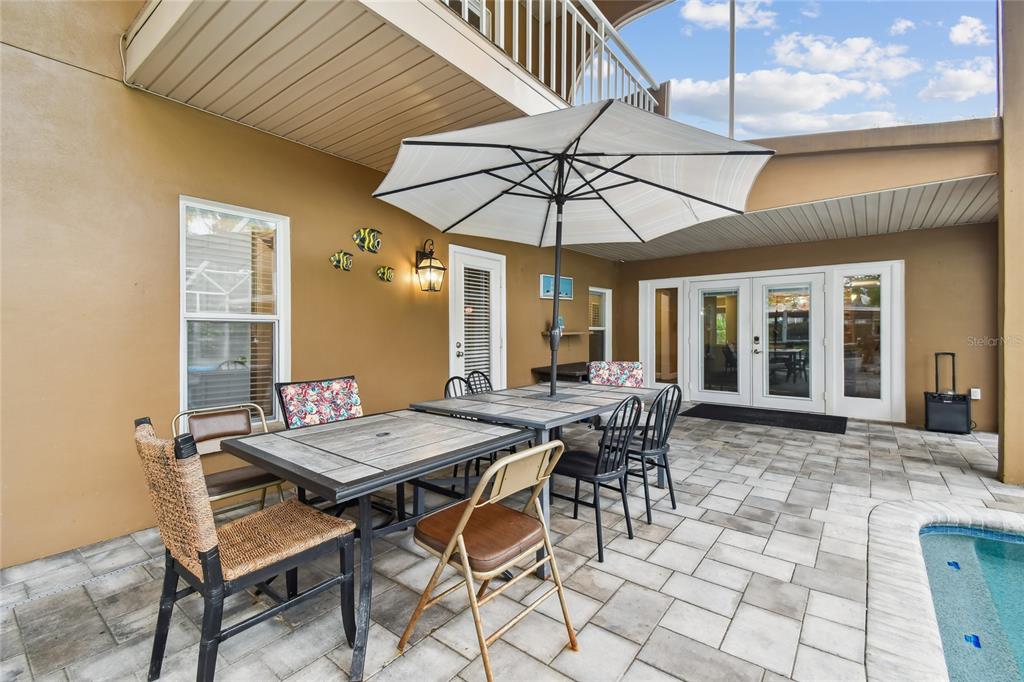 1948 Belleair Road Clearwater, FL 33764 - Photo 71 of 84 a view of a dining room with furniture and chandelier
