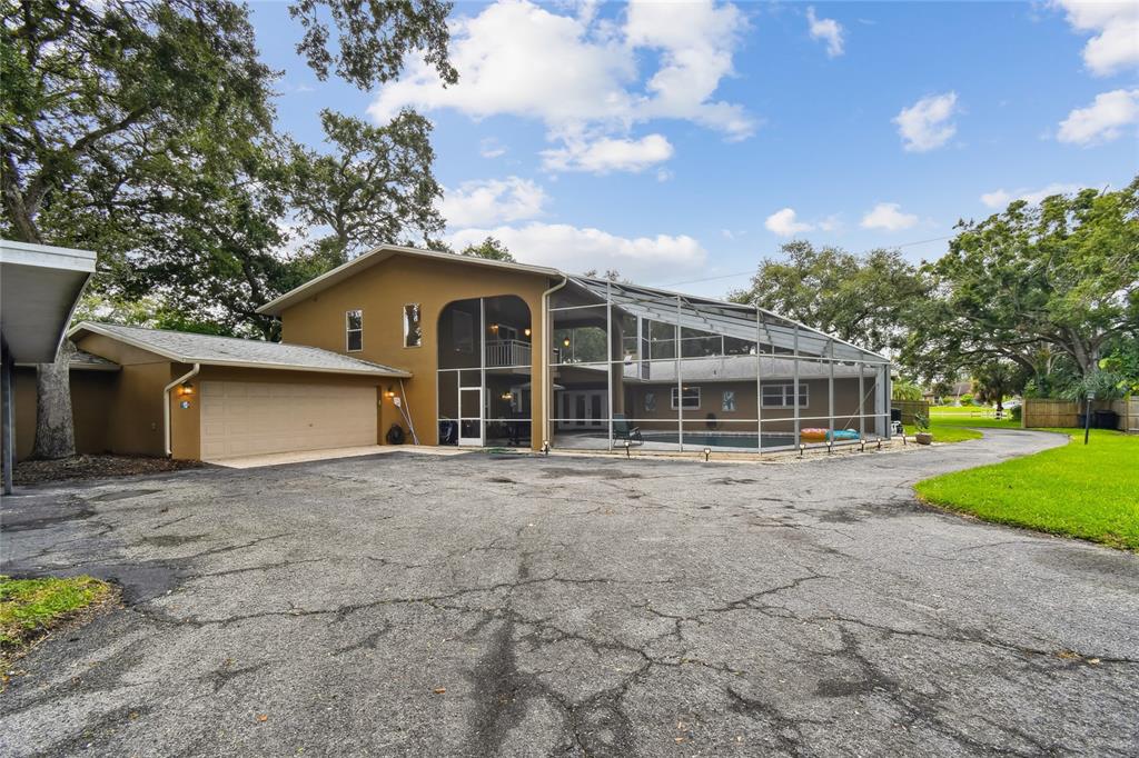 1948 Belleair Road Clearwater, FL 33764 - Photo 73 of 84 a view of a house with a garden and pathway