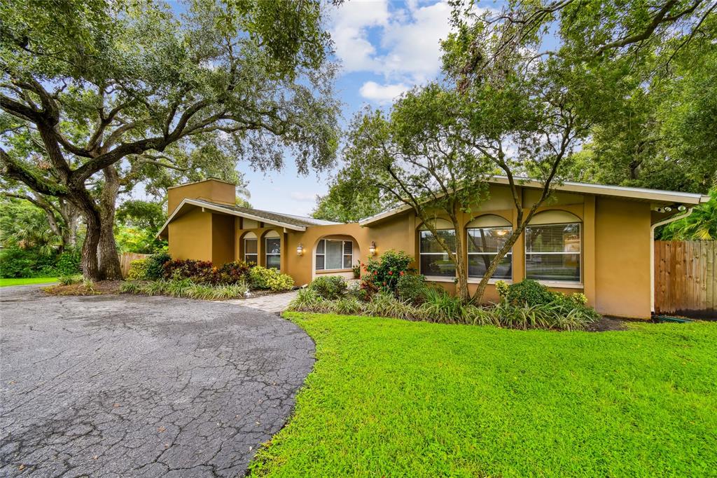 1948 Belleair Road Clearwater, FL 33764 - Photo 83 of 84 a front view of a house with garden