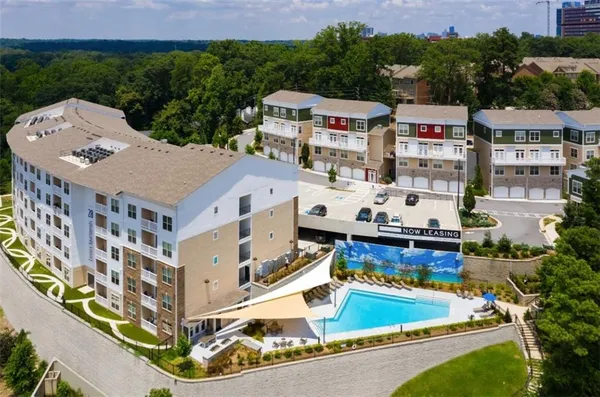 aerial view of a house with swimming pool and ocean view