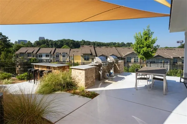 a view of a patio with swimming pool