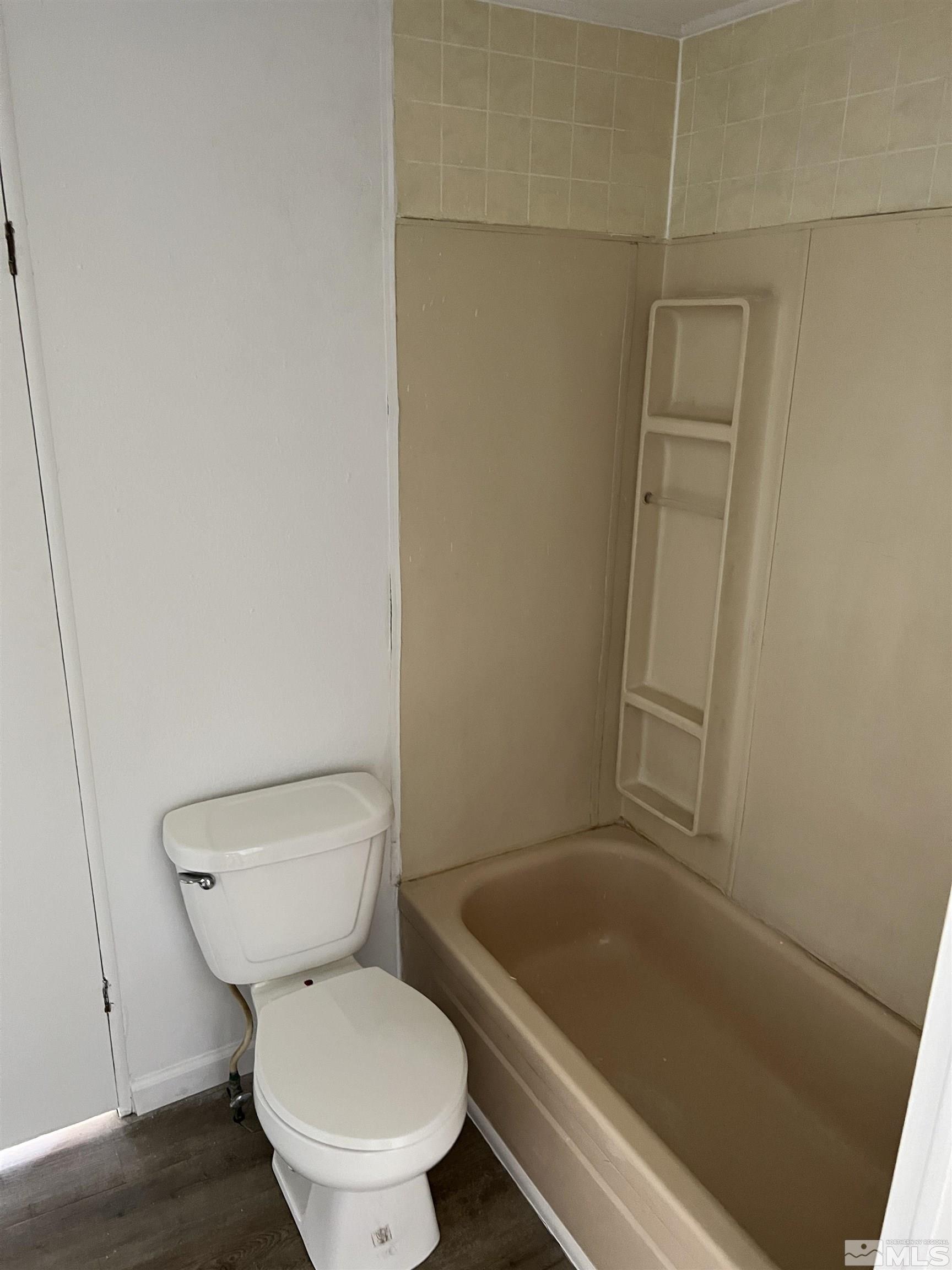 1495 Rice Road Fallon, NV 89406 - Photo 5 of 22 a white toilet sitting next to a bath tub