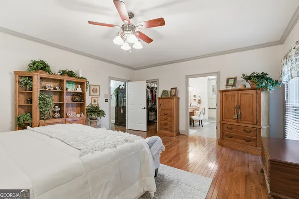a bathroom with a granite countertop toilet sink and mirror