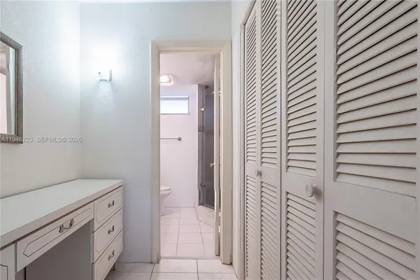 a bathroom with a shower and a sink