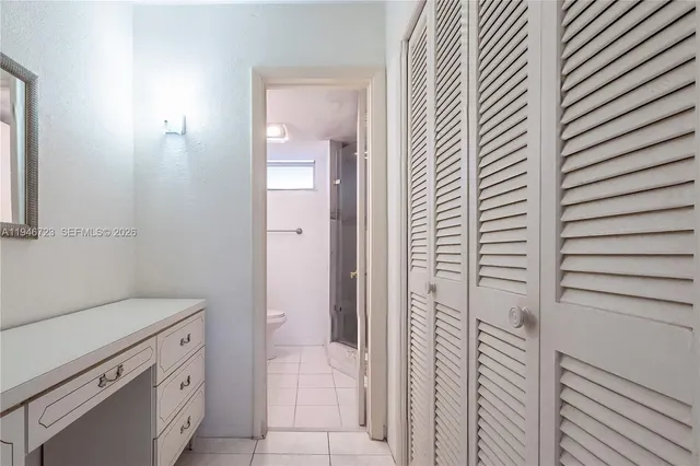 a bathroom with a shower and a sink