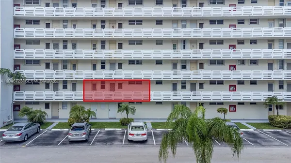 a large building with a table and chairs in it