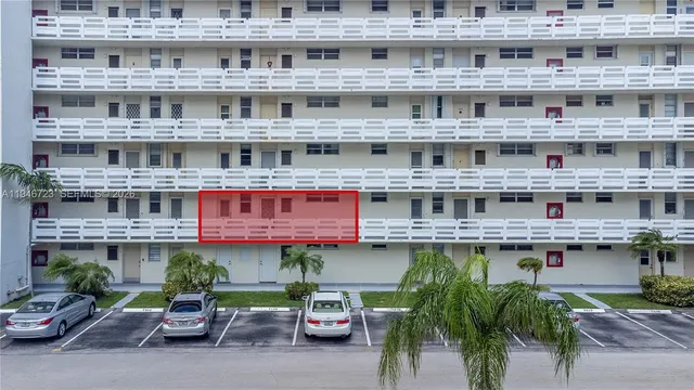 a large building with a table and chairs in it