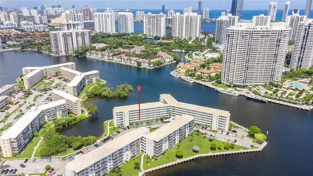 a view of a lake with tall buildings