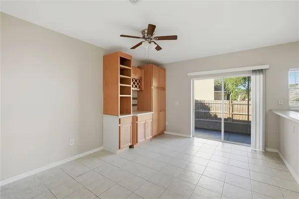a view of a livingroom with a furniture and a ceiling fan