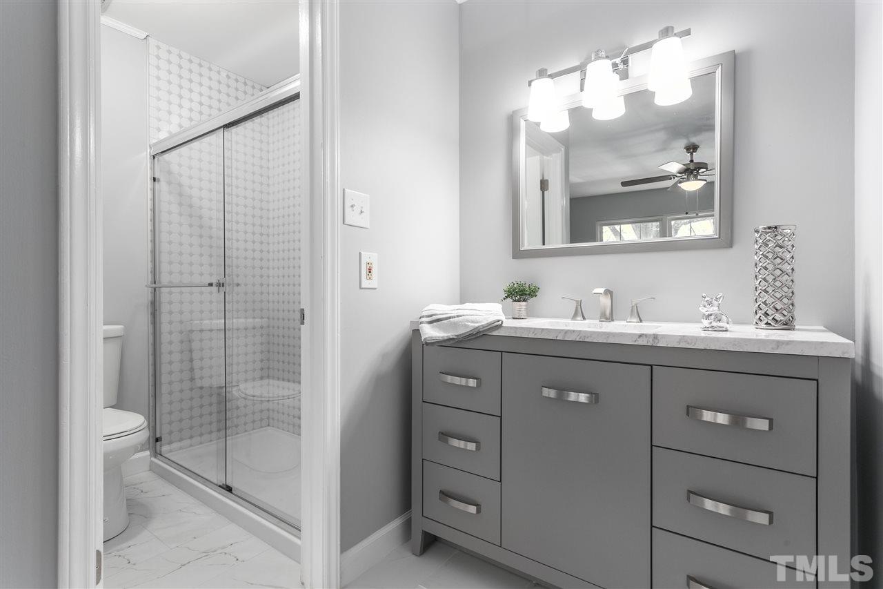 6453 New Market Way, Unit 6453 Raleigh, NC 27615 - Photo 6 of 30 Beautiful new vanity and tile await your morning routine!