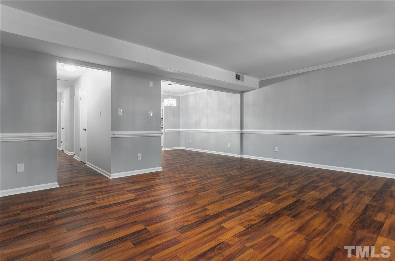 6453 New Market Way, Unit 6453 Raleigh, NC 27615 - Photo 9 of 30 No shortage of ways to arrange your belongings in this spacious living room!