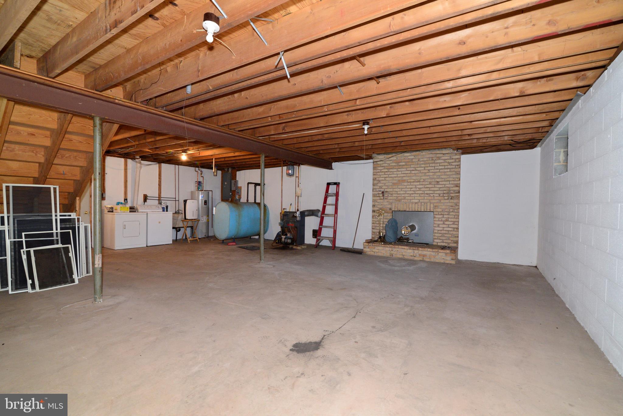 43157 Lucketts Road Leesburg, VA 20176 - Photo 23 of 56 Unfinished basement; brick FP (wood stove ready)